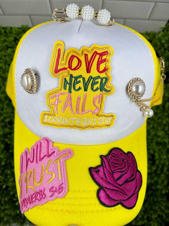 Love Never Fails Yellow - Junk Trucker Hat